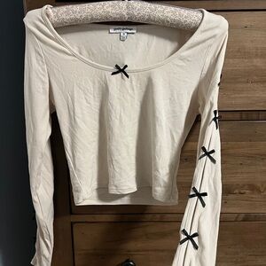 Simons Pretty Garbage Cream Long Sleeve Top with Black Bow Accents